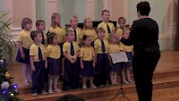 Vánoční koncert přípravného sboru Ostrováček v aule školy